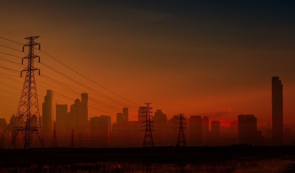 The blackout in Spain and Portugal shows dark cityscape with electricity pylon. Source: Shutterstock